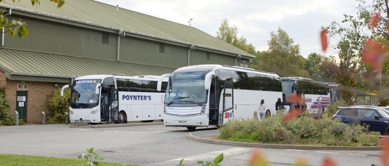 Buses parked outside John Ashby Sports Hall