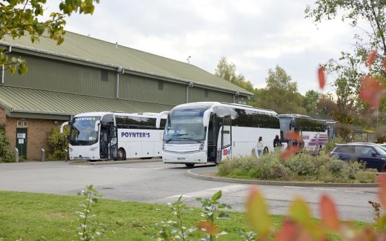Buses parked outside John Ashby Sports Hall
