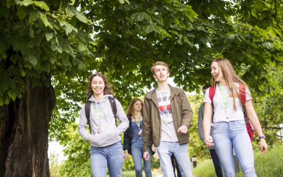 Students walking through arboretum 175