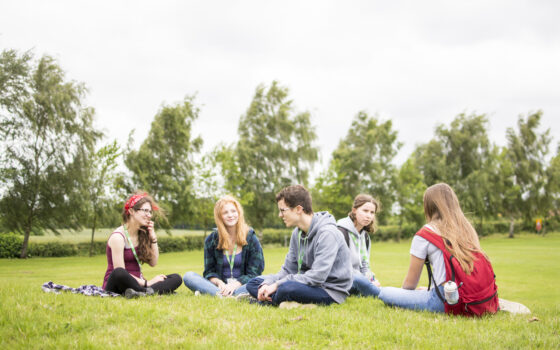 Group of Students sitting on the grass