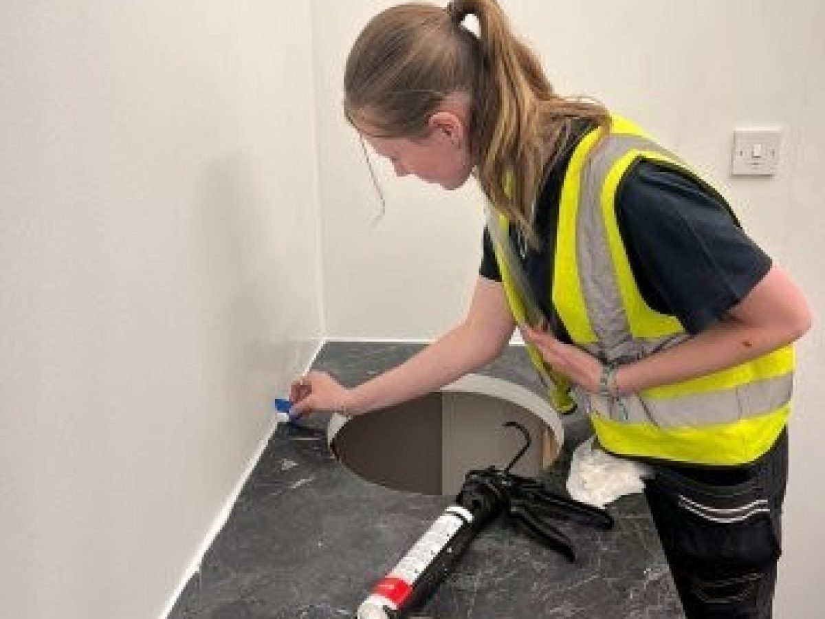 Moulton College student fitting sink units