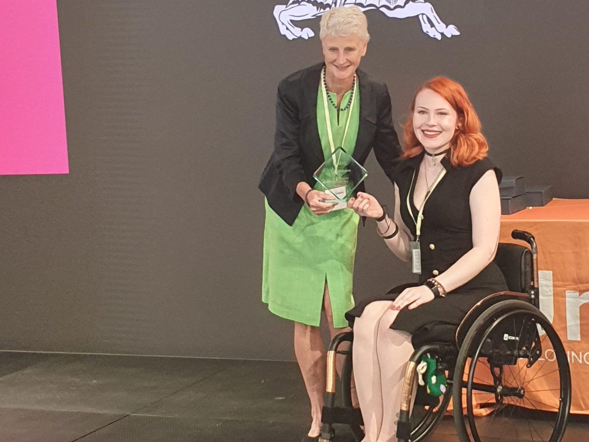 Ivy being presented with her award in London