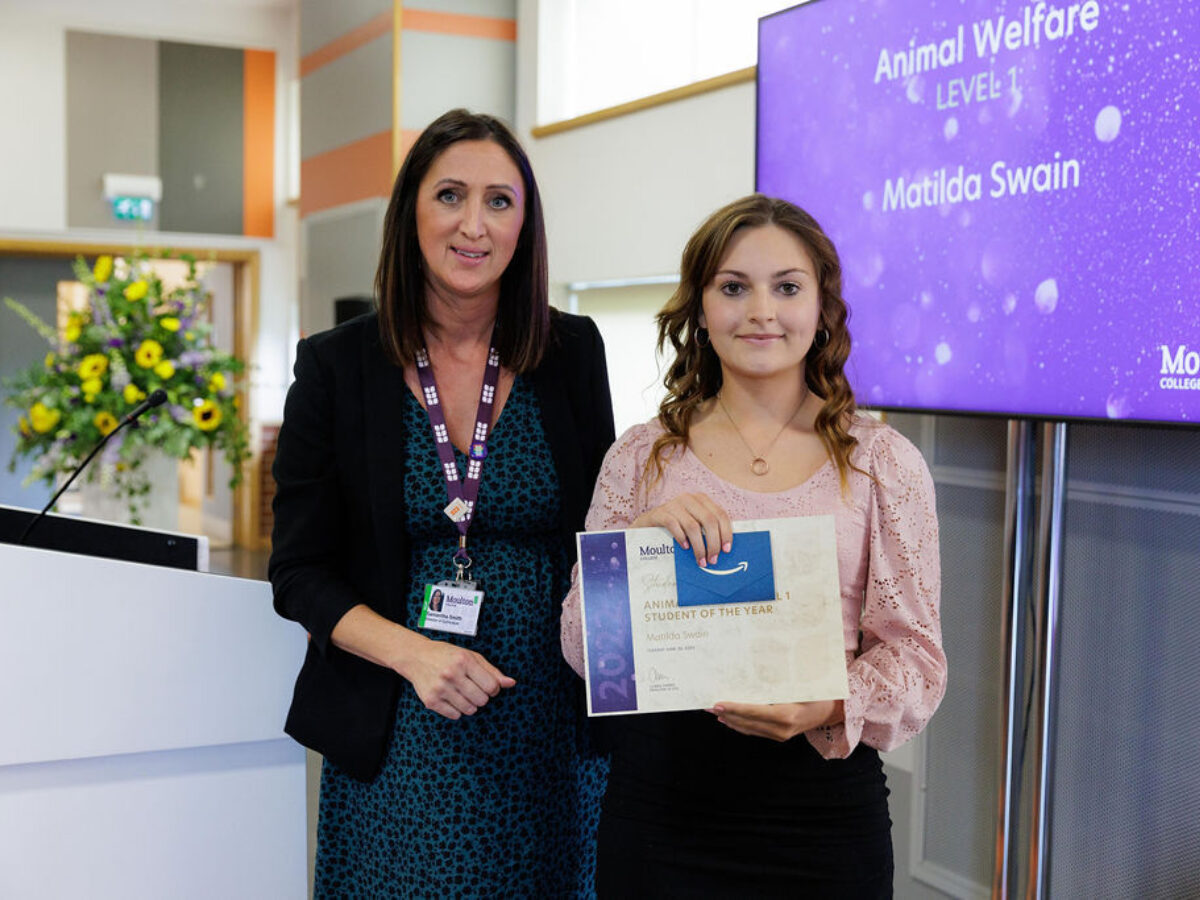 Level 2 Animal Welfare Award winner Matilda receives her award from Director of Curriculum, Sam Smith
