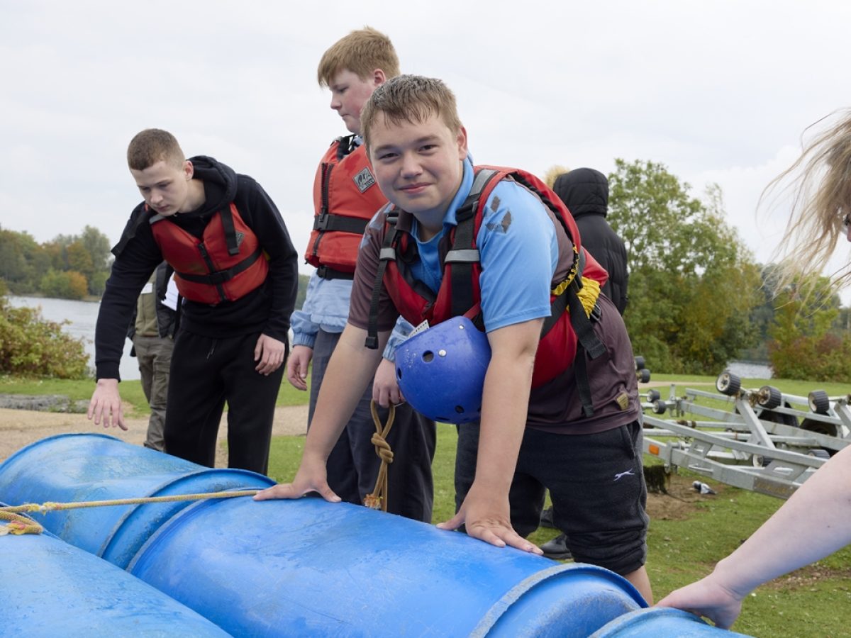Student building a raft