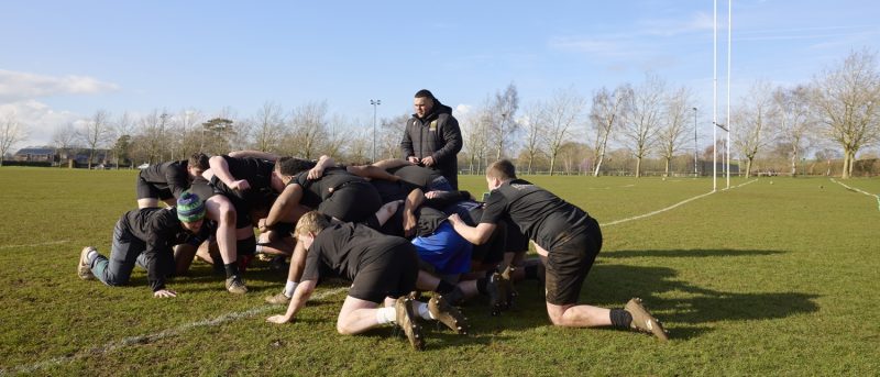 Academy students rugby scrum