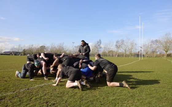 Academy students rugby scrum