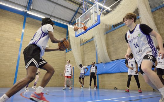 Sports students playing basketball