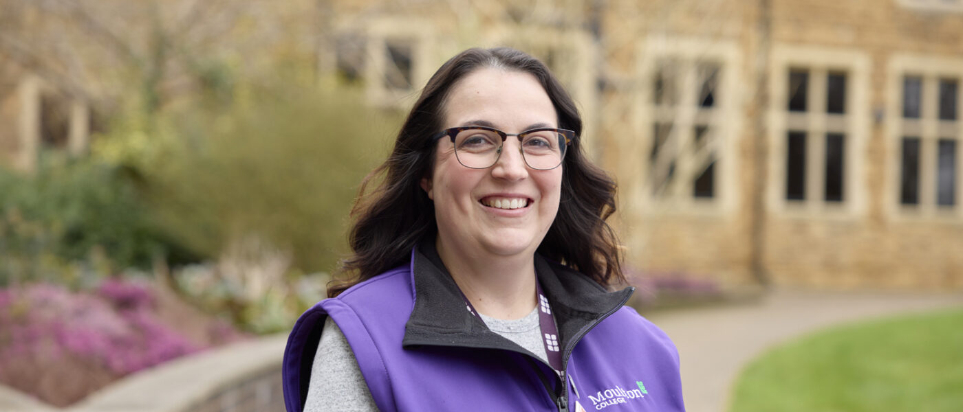 Careers Advisor smiling wearing a purple moulton vest