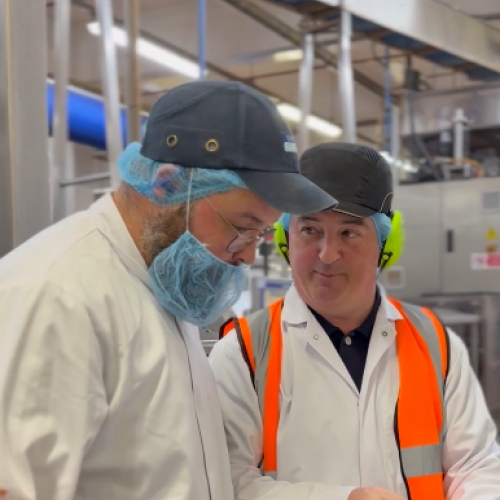 Apprentice and Line Manger on factory floo